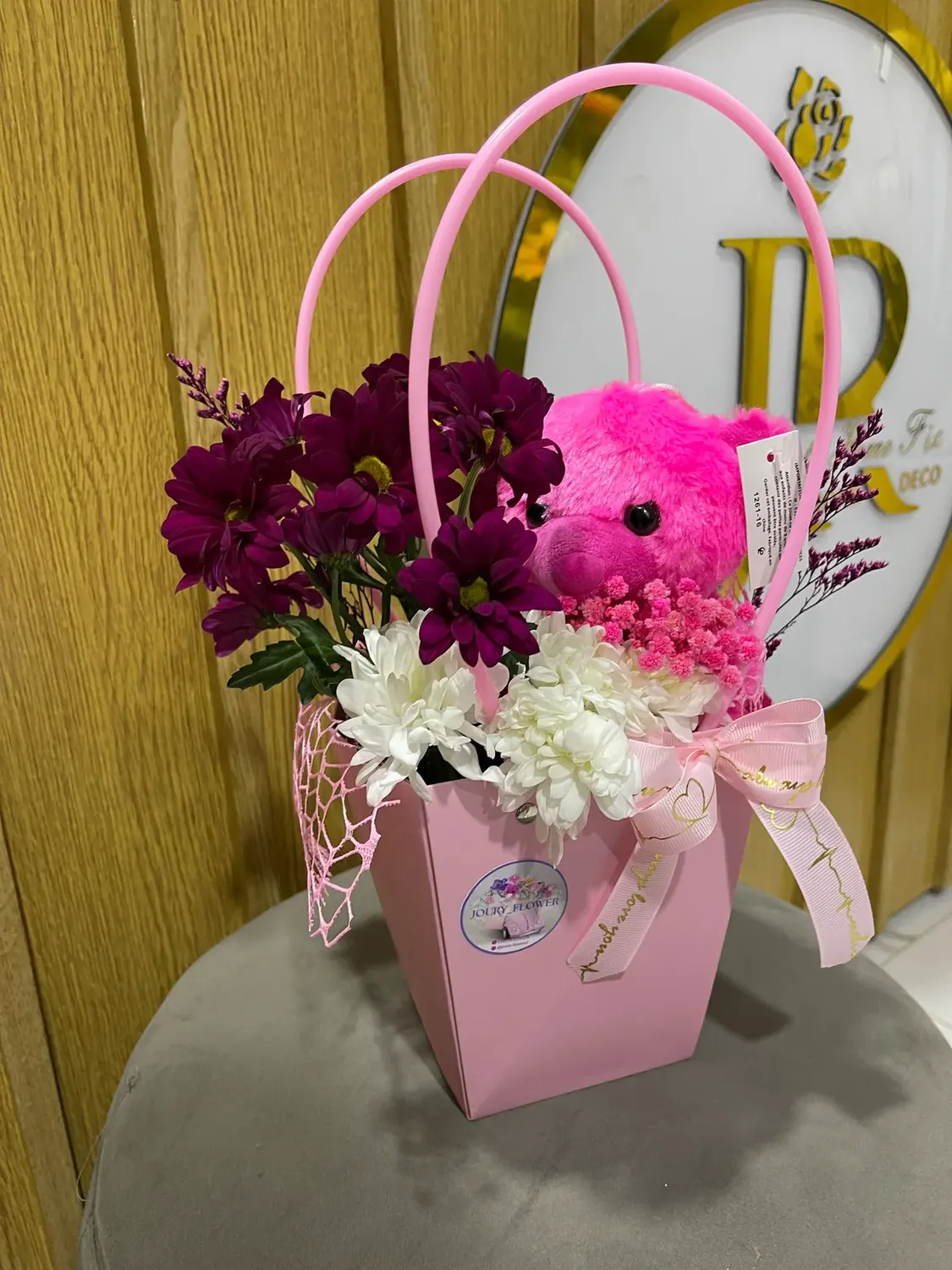 Flower pocket bouquet with layered pink wrapping by Joury Flowers