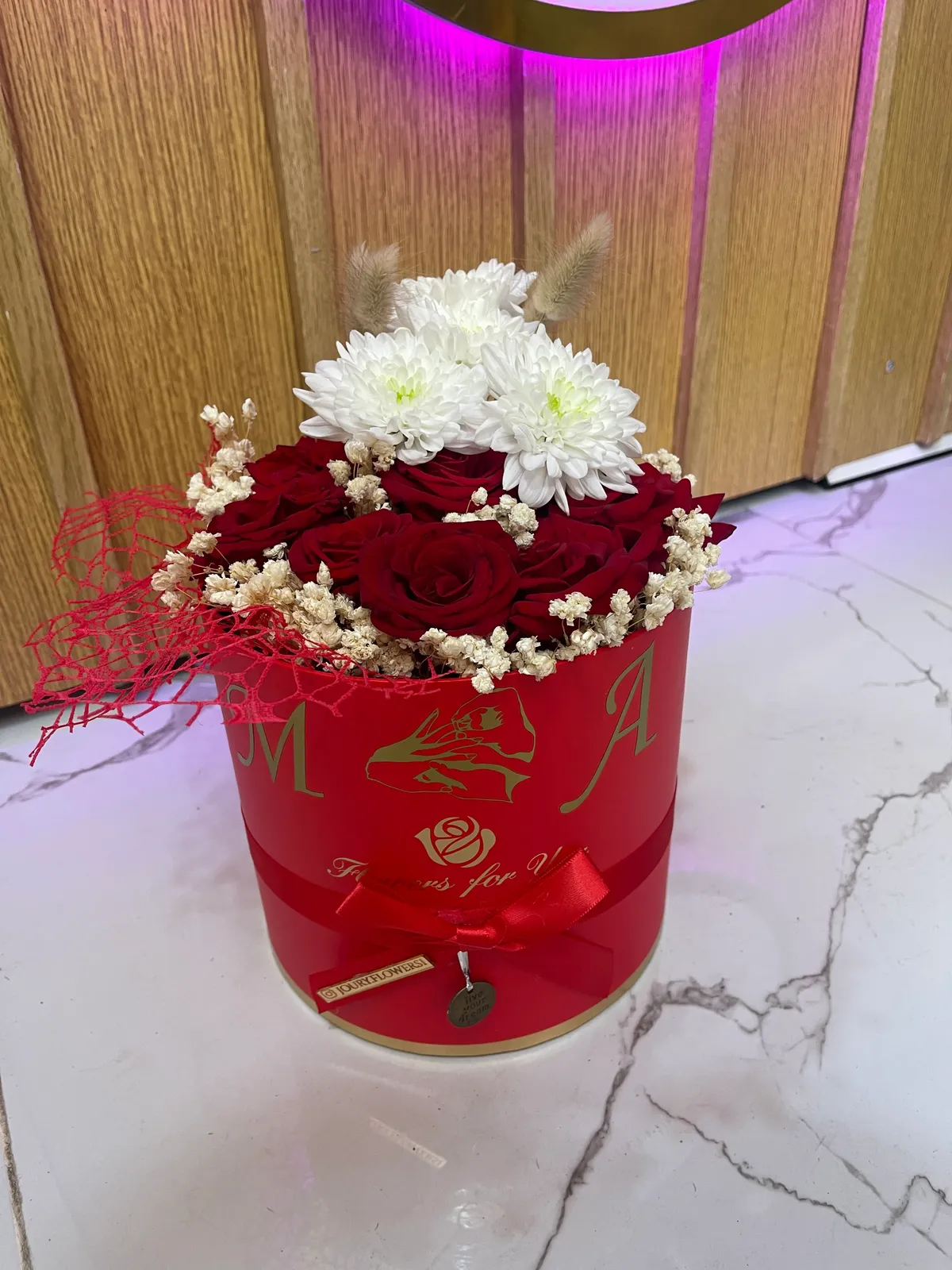 Round red bloom box by Joury Flowers
